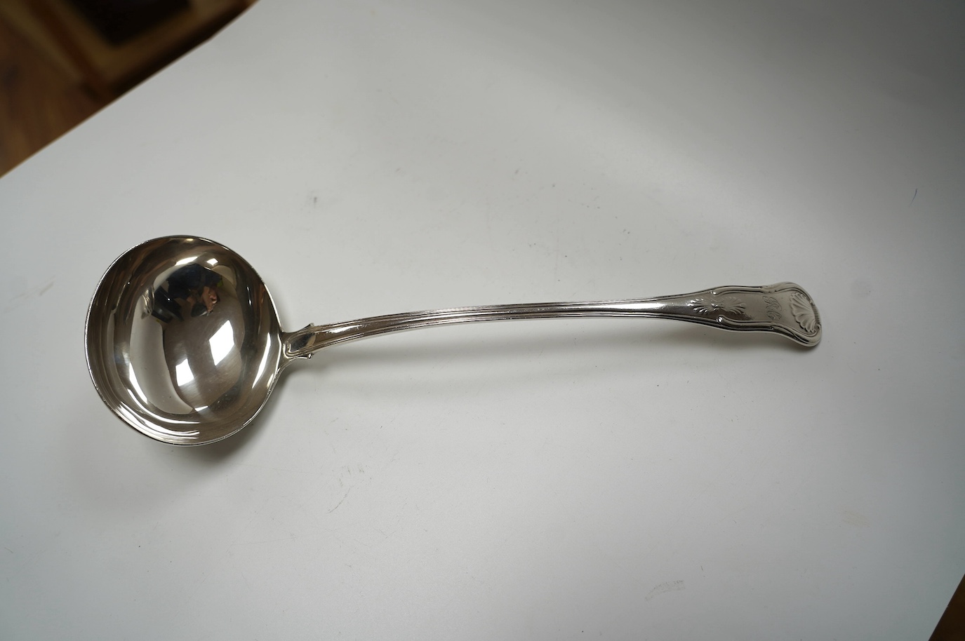 A George IV silver King's pattern soup ladle, by John & Henry Lias, London, 1822, 33.5cm, 9.1oz. Condition - poor to fair